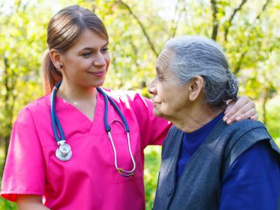 Nurse and patient outdoors