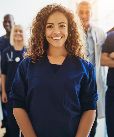 FemaleNurseStandingInGroup