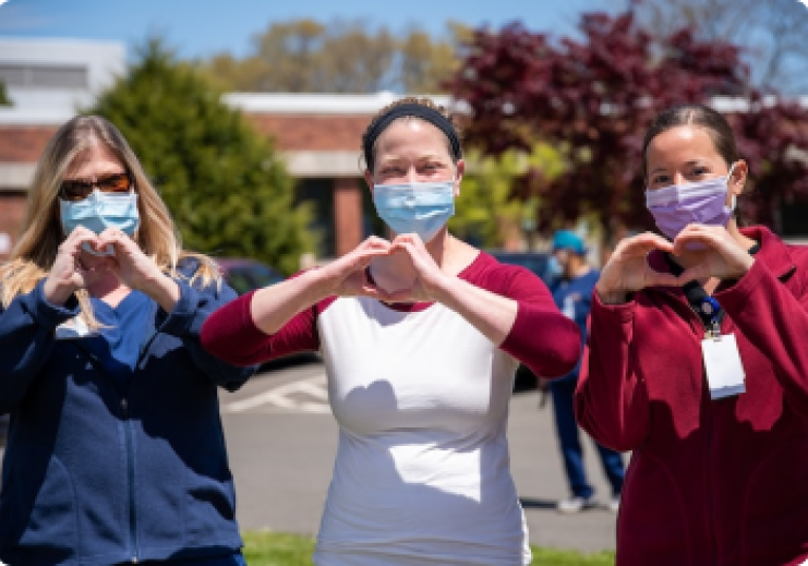 Nurses making hearts with their hands